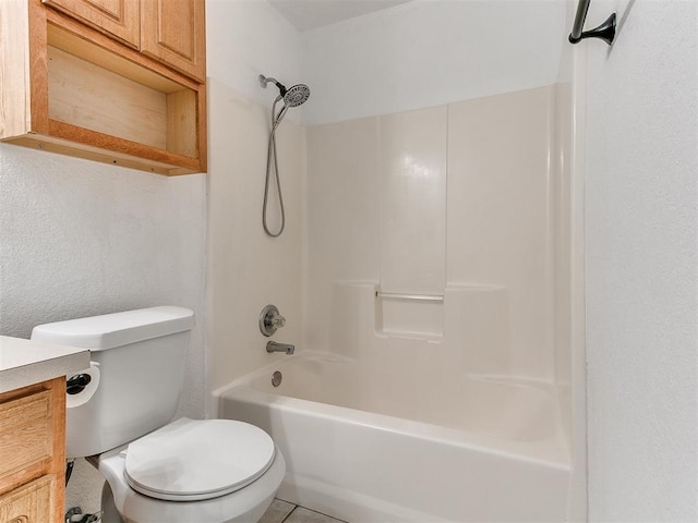 full bathroom featuring tile patterned flooring, vanity, bathtub / shower combination, and toilet