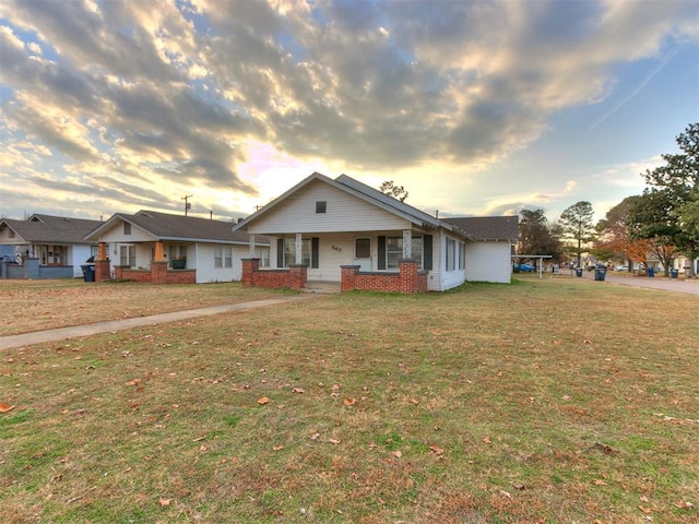 view of front of house with a yard