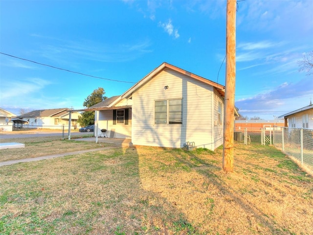 view of property exterior featuring a lawn