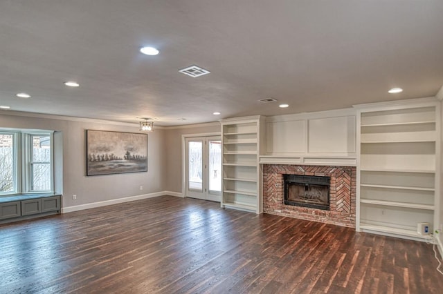 unfurnished living room featuring dark wood-style flooring, a fireplace, visible vents, and baseboards