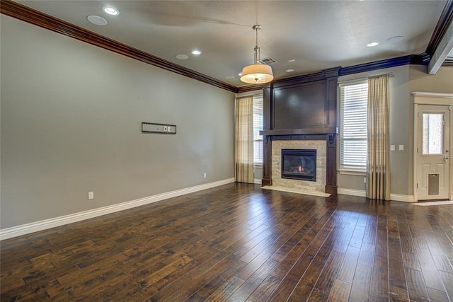 unfurnished living room featuring dark hardwood / wood-style flooring and ornamental molding