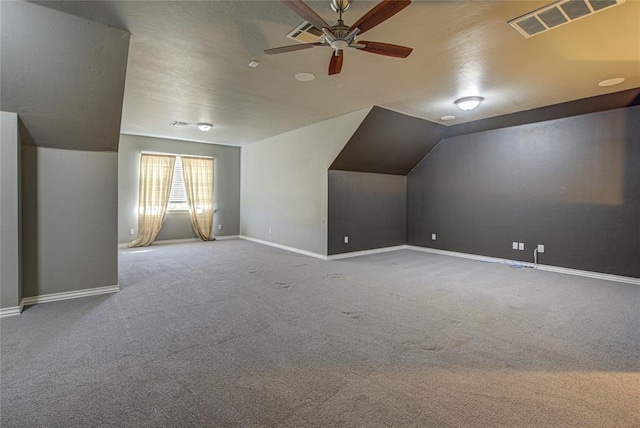 bonus room with carpet, ceiling fan, and lofted ceiling