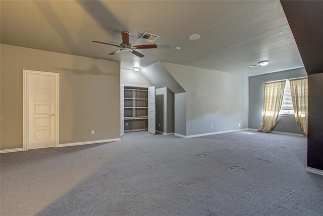 bonus room with ceiling fan, carpet floors, and vaulted ceiling