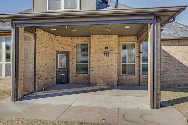 entrance to property with a patio area