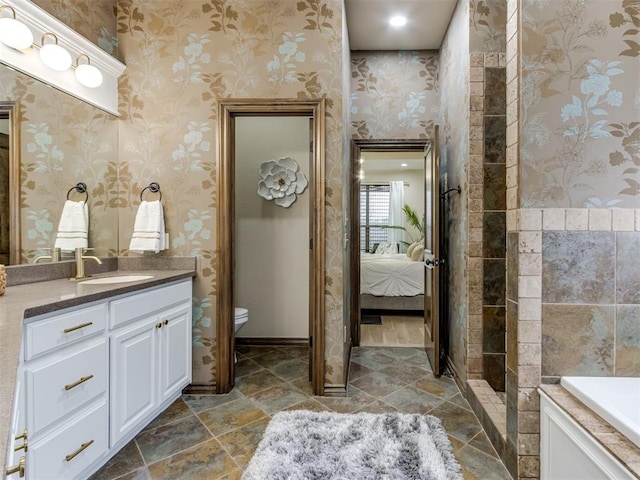 bathroom with vanity and toilet