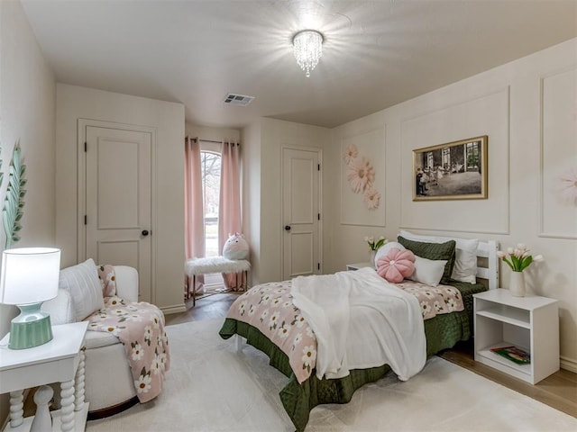 bedroom featuring light wood-type flooring