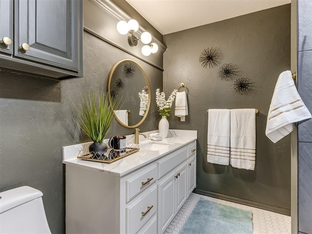 bathroom with vanity and toilet