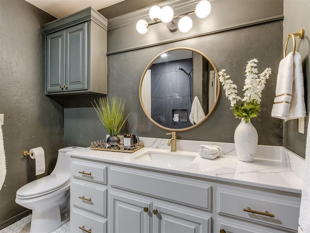 bathroom with vanity, walk in shower, and toilet