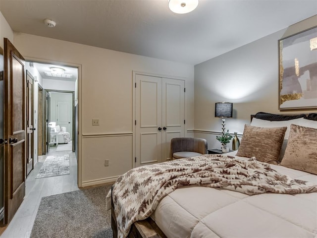 bedroom with hardwood / wood-style flooring and a closet