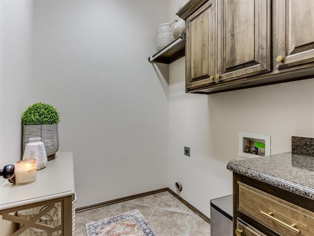 laundry room featuring cabinets, washer hookup, and hookup for an electric dryer