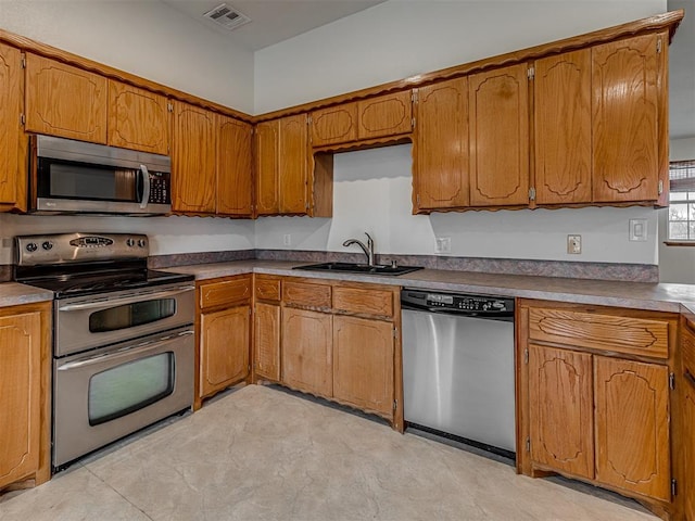 kitchen featuring appliances with stainless steel finishes and sink