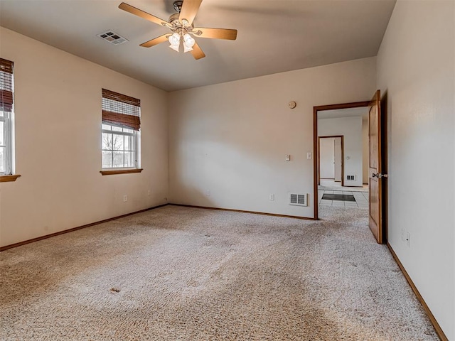 carpeted empty room with ceiling fan