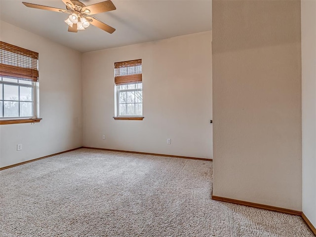 carpeted empty room with ceiling fan