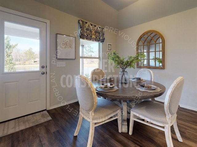 dining area with dark wood-type flooring and a healthy amount of sunlight