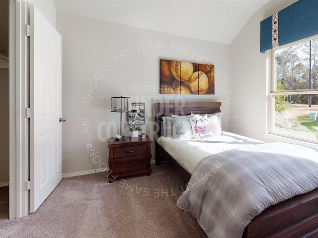 carpeted bedroom with lofted ceiling