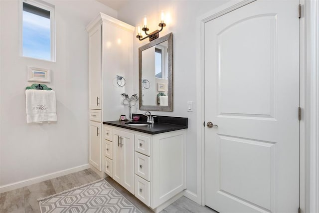 bathroom featuring vanity and wood-type flooring