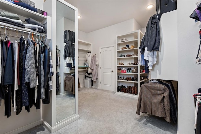 walk in closet featuring carpet