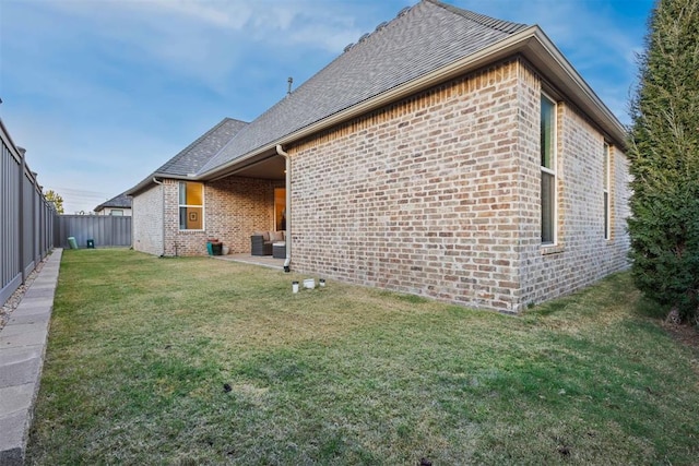 view of property exterior featuring a yard