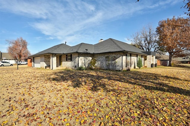 view of side of property with a garage