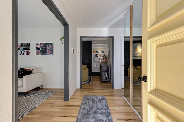 corridor featuring light hardwood / wood-style flooring