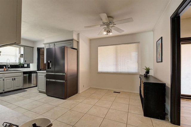 kitchen with stainless steel dishwasher, ceiling fan, sink, fridge with ice dispenser, and gray cabinets