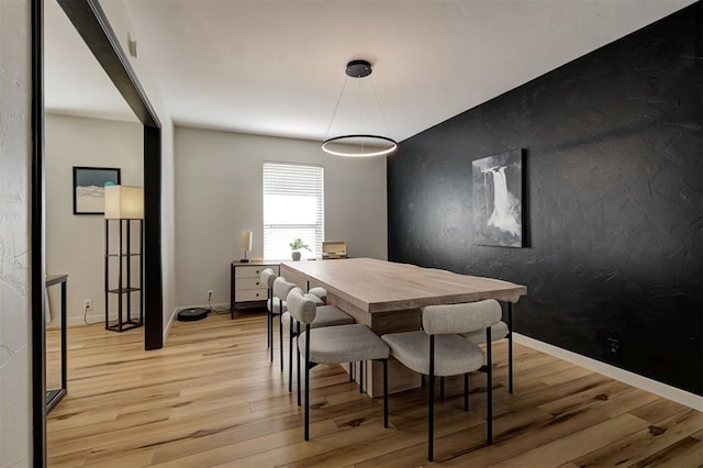 dining room with light wood-type flooring