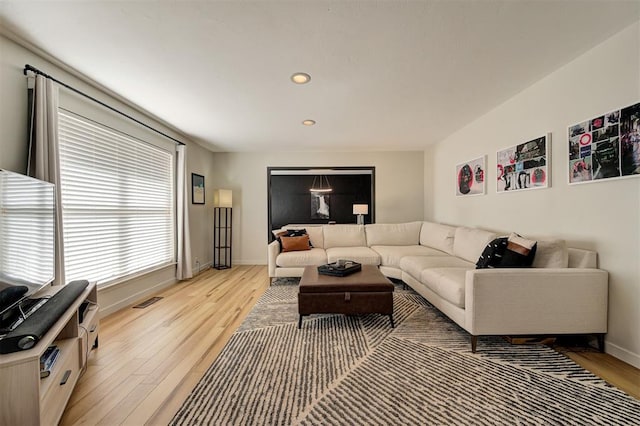 living room with light hardwood / wood-style flooring