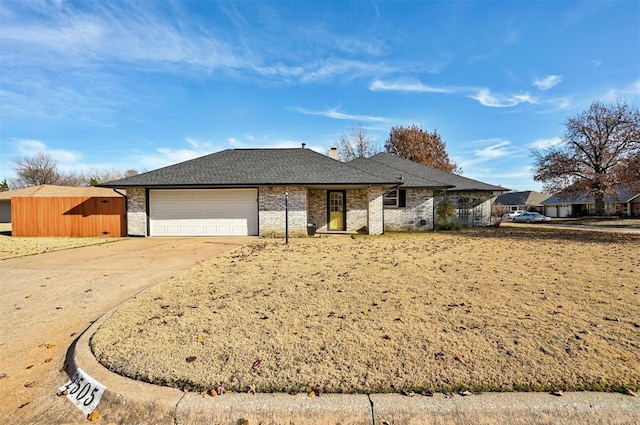 ranch-style home featuring a garage