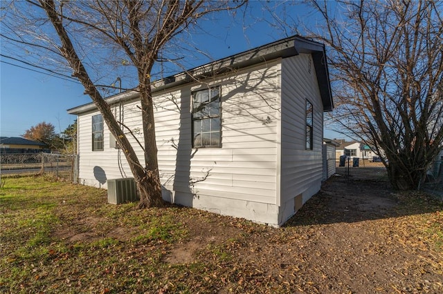 view of side of property with central AC