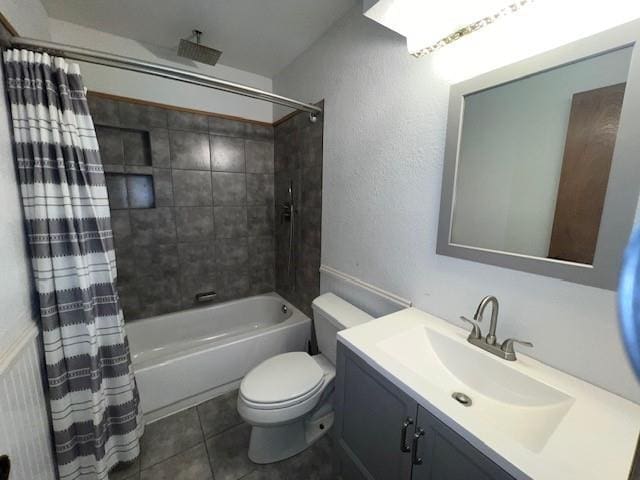 full bathroom with tile patterned flooring, vanity, shower / tub combo, and toilet