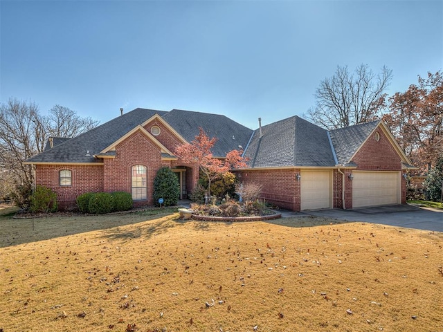 view of front of home with a garage and a front yard