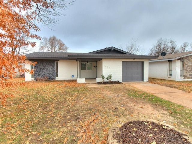 ranch-style home featuring a garage