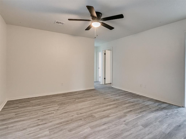 unfurnished room featuring ceiling fan and light hardwood / wood-style floors