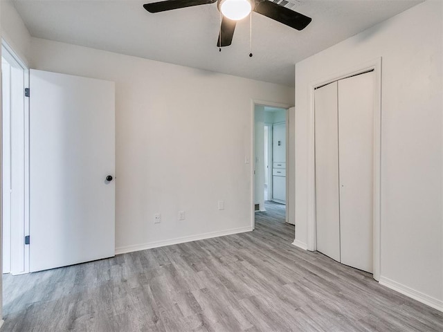 unfurnished bedroom featuring a closet, ceiling fan, and light hardwood / wood-style flooring