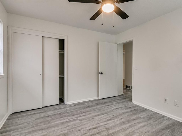 unfurnished bedroom with a closet, ceiling fan, and light hardwood / wood-style flooring