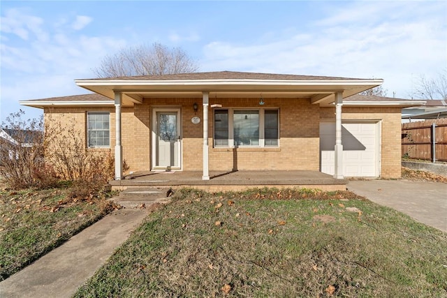 view of front facade with a porch and a garage