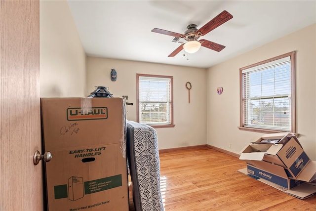 bedroom featuring light wood-type flooring and ceiling fan