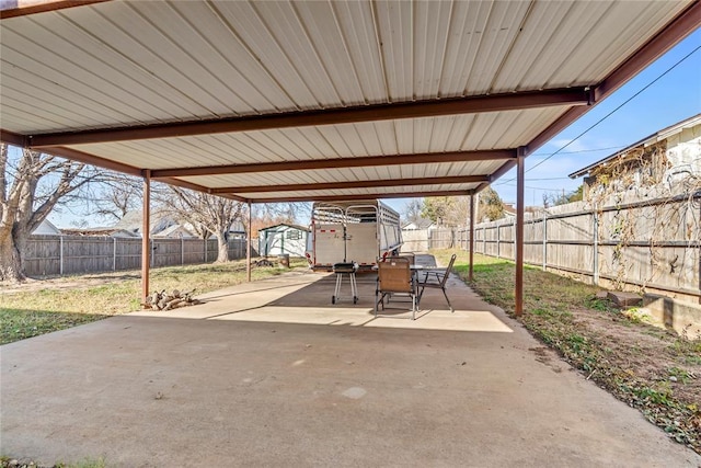 view of patio with a storage unit