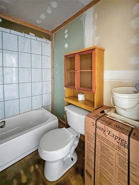 bathroom with a tub and toilet