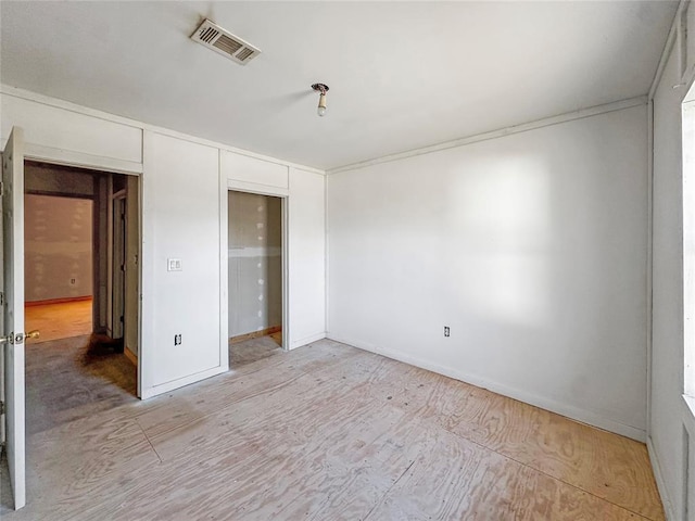 unfurnished bedroom with a closet