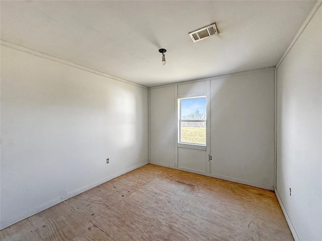 323 S Birch Ave, Erick, OK 73645 - spare room featuring baseboards and wood finished floors