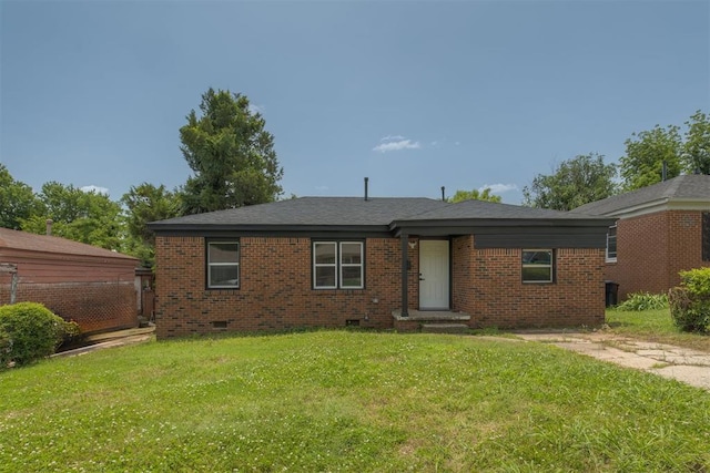 2704 NE Success St, Oklahoma City, OK 73111 - view of front of home with crawl space, a front lawn, and brick siding