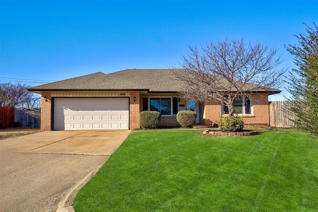 single story home featuring a garage and a front lawn