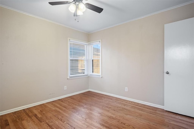 empty room with wood-type flooring, ceiling fan, and ornamental molding