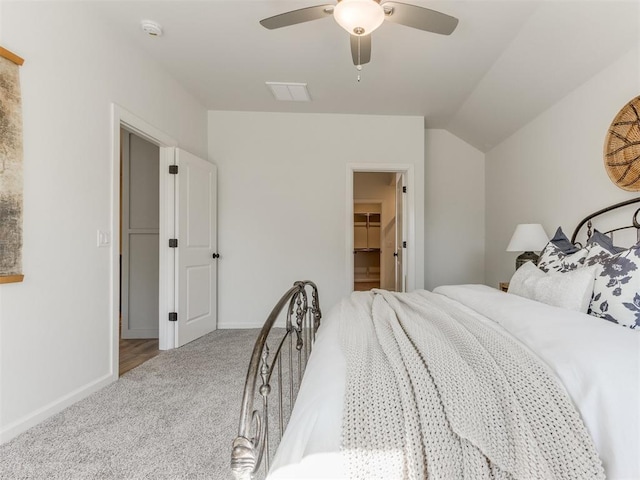 bedroom featuring carpet, visible vents, vaulted ceiling, ceiling fan, and baseboards