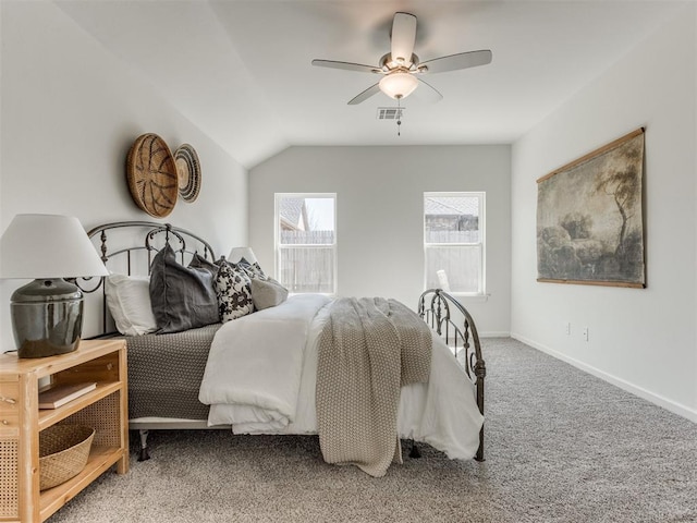 bedroom featuring visible vents, baseboards, a ceiling fan, carpet, and vaulted ceiling