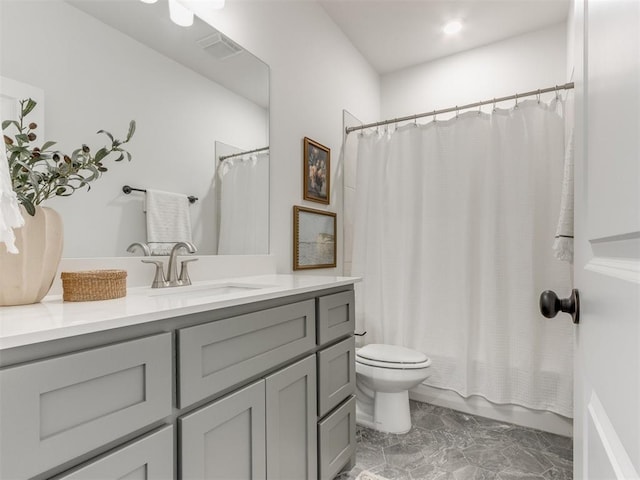 full bath with visible vents, shower / tub combo, vanity, and toilet