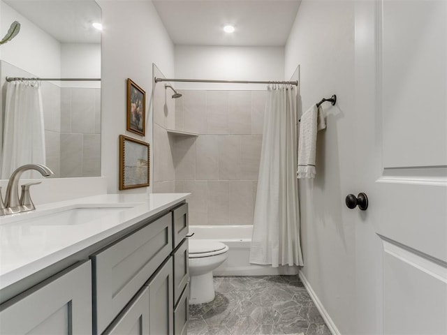 bathroom featuring toilet, shower / tub combo, vanity, baseboards, and marble finish floor