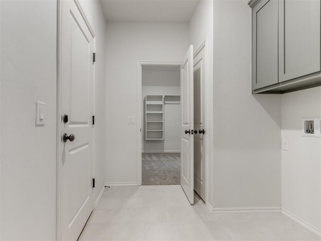 interior space with light colored carpet and baseboards