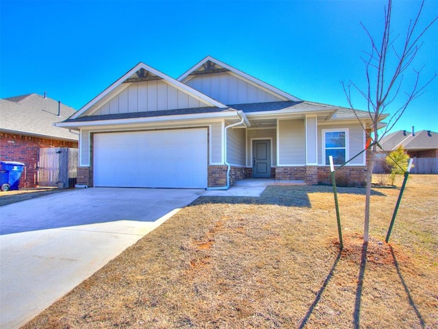 craftsman-style home with a garage, driveway, board and batten siding, and brick siding